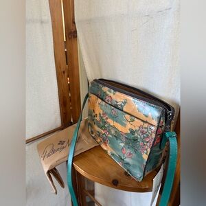 Patricia Nash "Beautiful Girl" print leather crossbody bag.